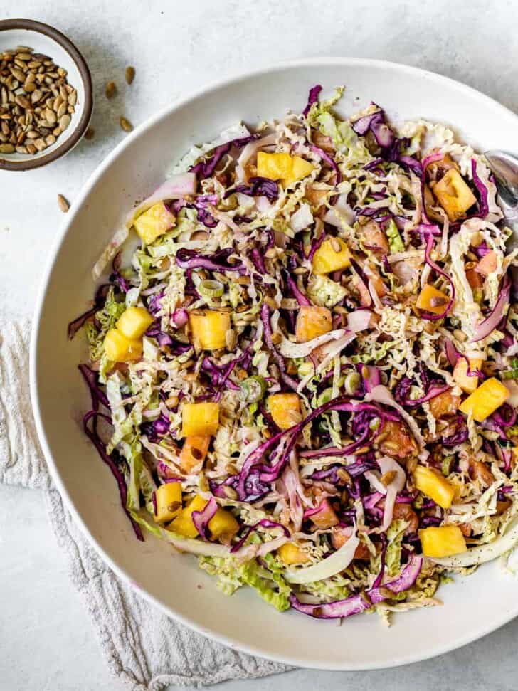 Pineapple coleslaw with yogurt dressing in bowl