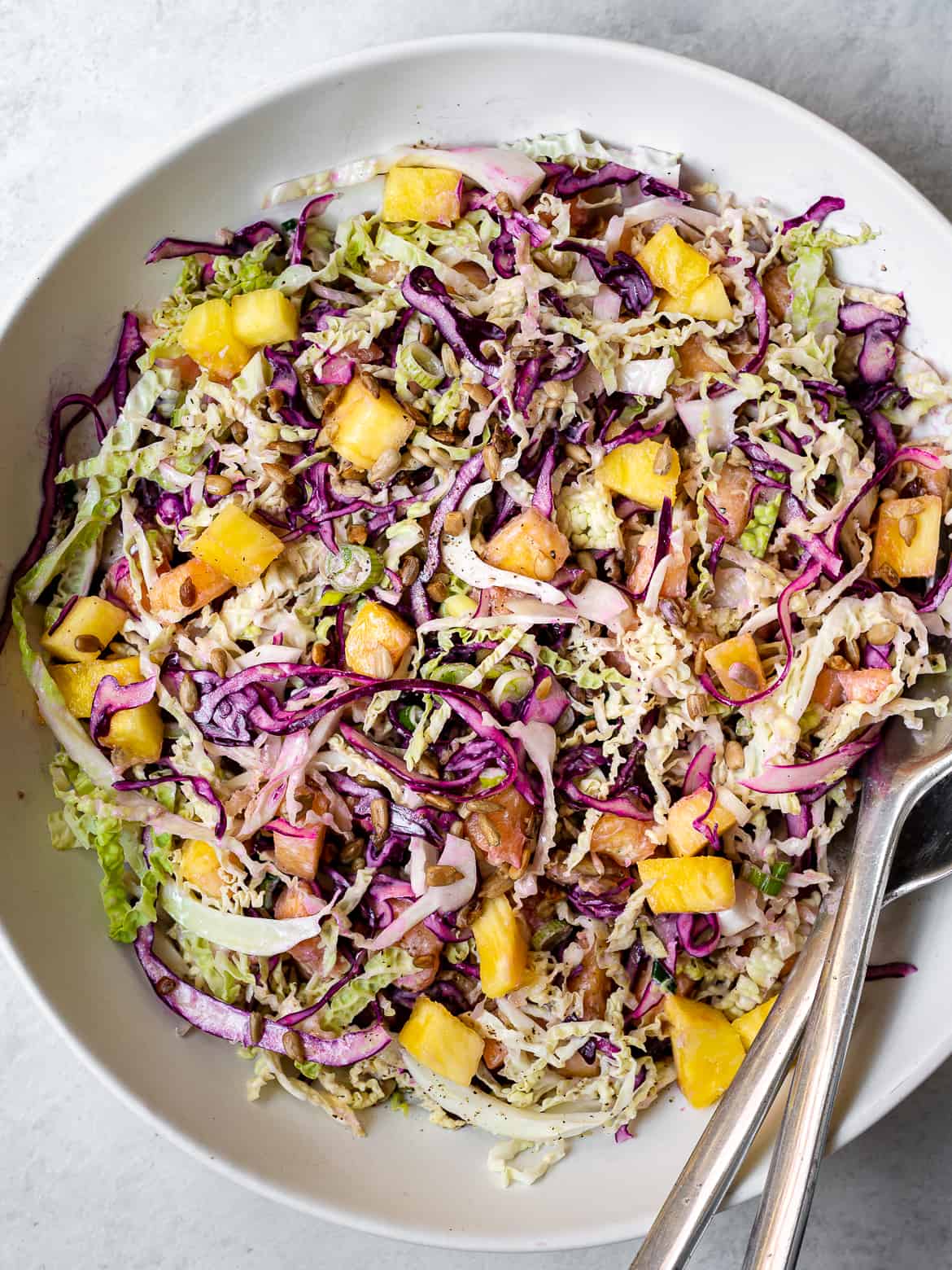 Pineapple coleslaw with yogurt dressing in bowl