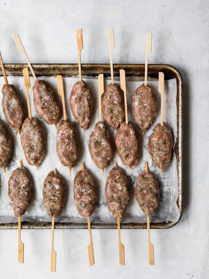 Shaped kofta kebabs on sheet pan