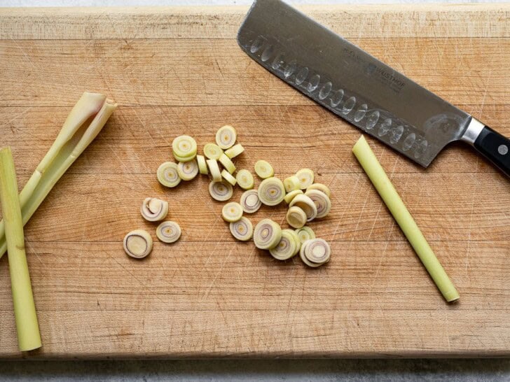 chopping lemongrass stalk on cutting board