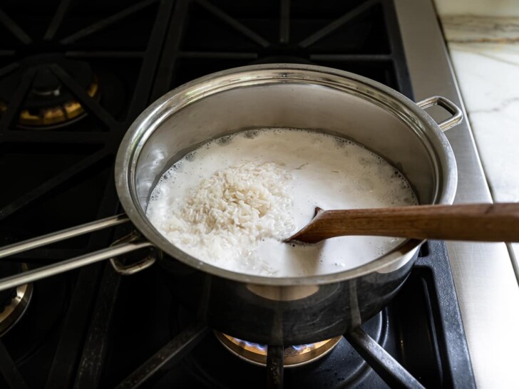 rice with water and coconut milk in pot