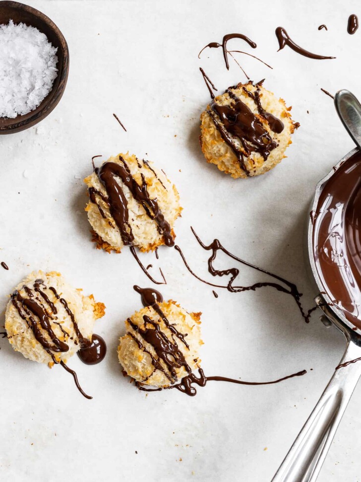 close up of chocolate drizzled macaroons