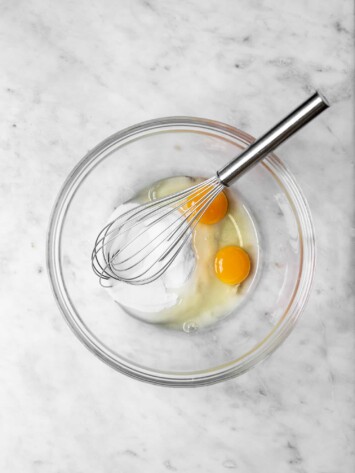 Whisking eggs and sugar in bowl