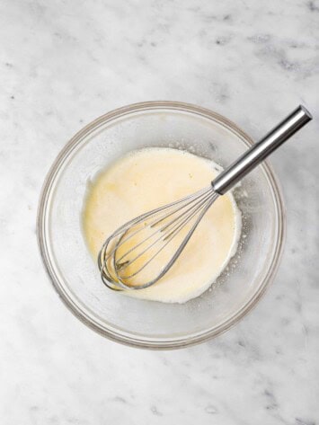Whisking eggs and sugar in bowl