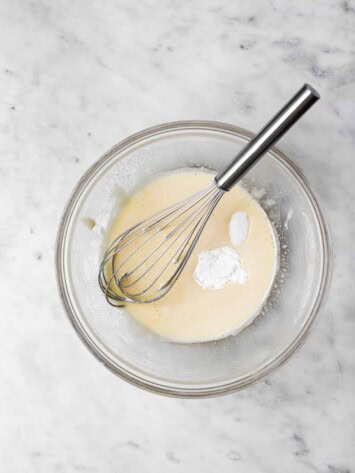 adding baking powder to egg mixture