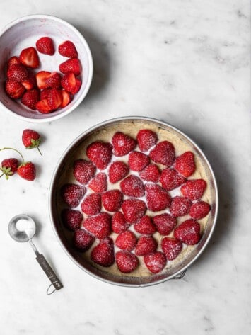 Placing strawberries on batter