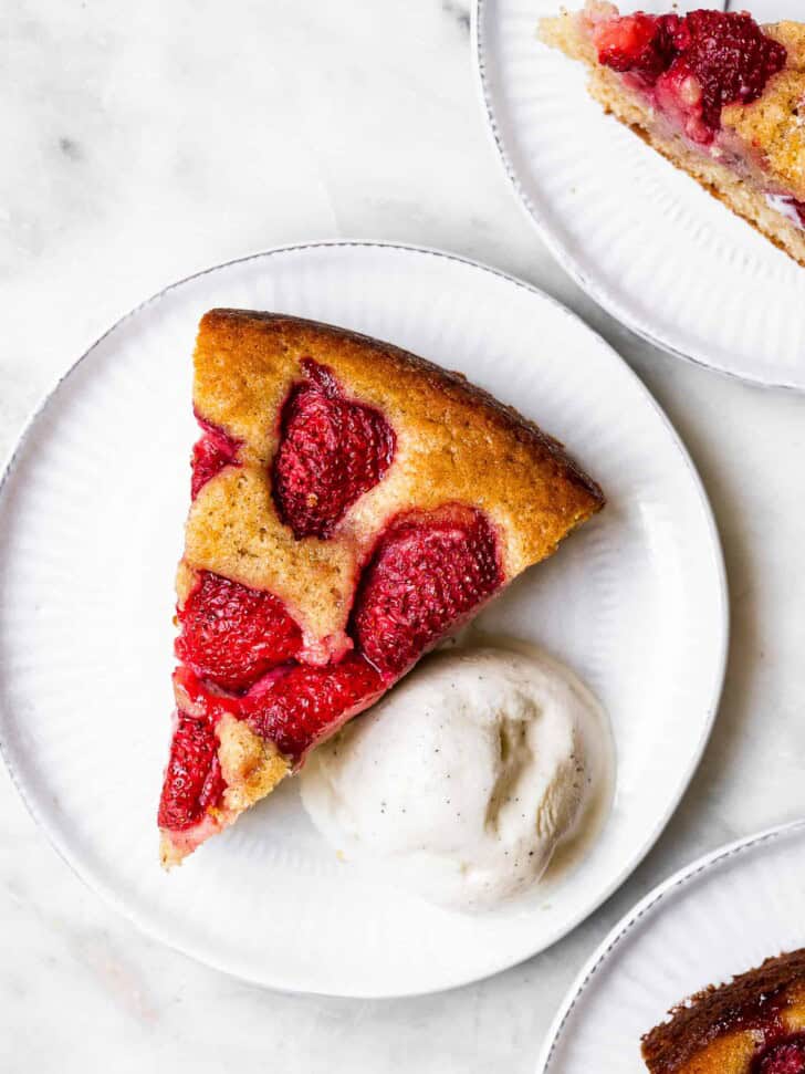 Piece of cake on plate with ice cream