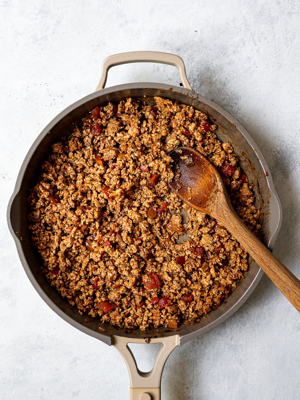 Cooked ground turkey with taco seasoning  in skillet. 