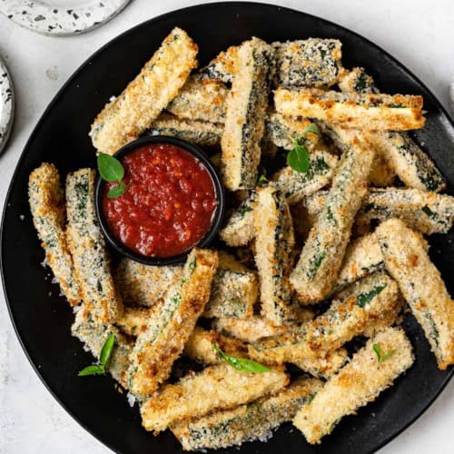 Baked Zucchini Fries on platter with marinara dipping sauce