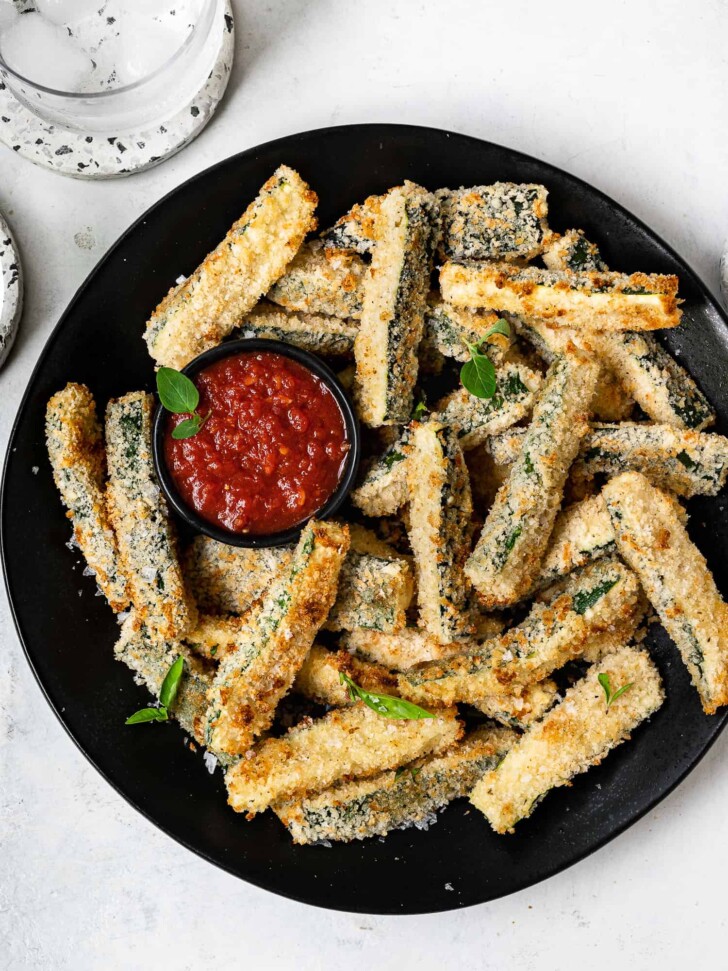 Baked Zucchini Fries on platter with marinara dipping sauce
