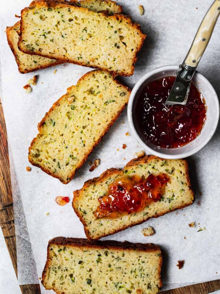 slices of zucchini bread with red pepper jelly