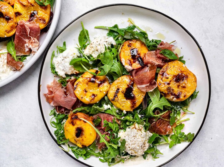Grilled Peach and Burrata Salad served on plate