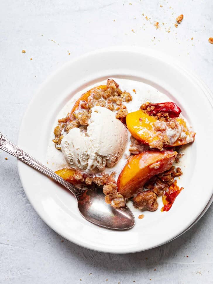 peach crisp and ice cream served in bowl