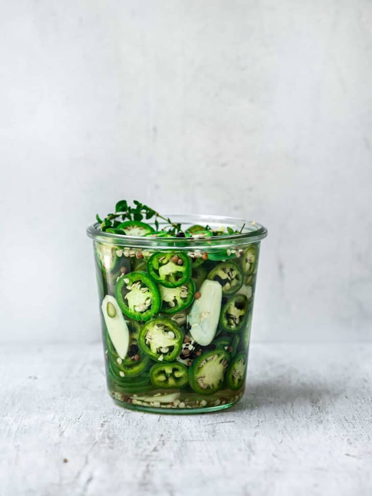 Quick pickled jalapeños in jar