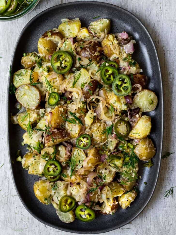 potato salad with caramelized shallots on platter