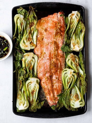 baked salmon on baking sheet with bok choy