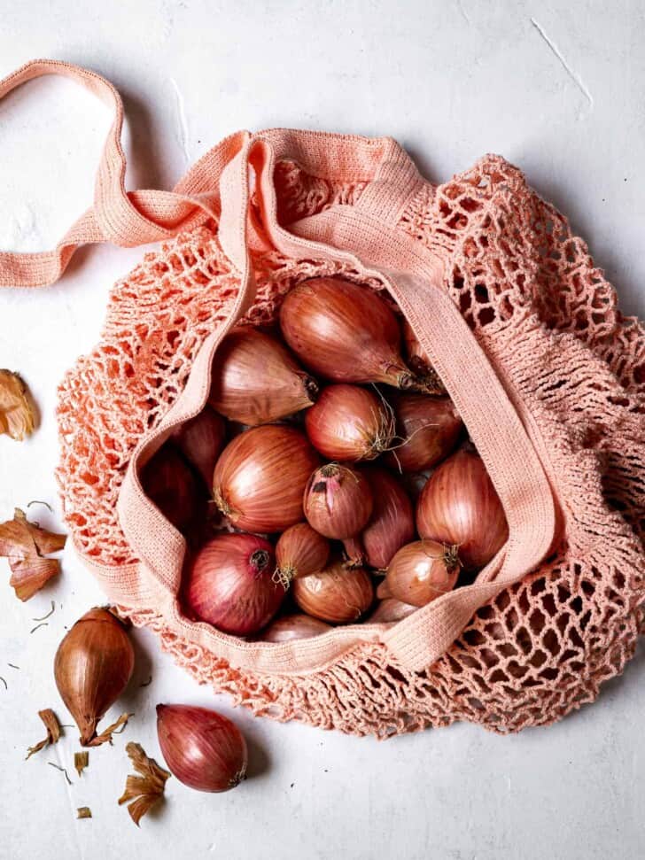 shallots in market mesh bag