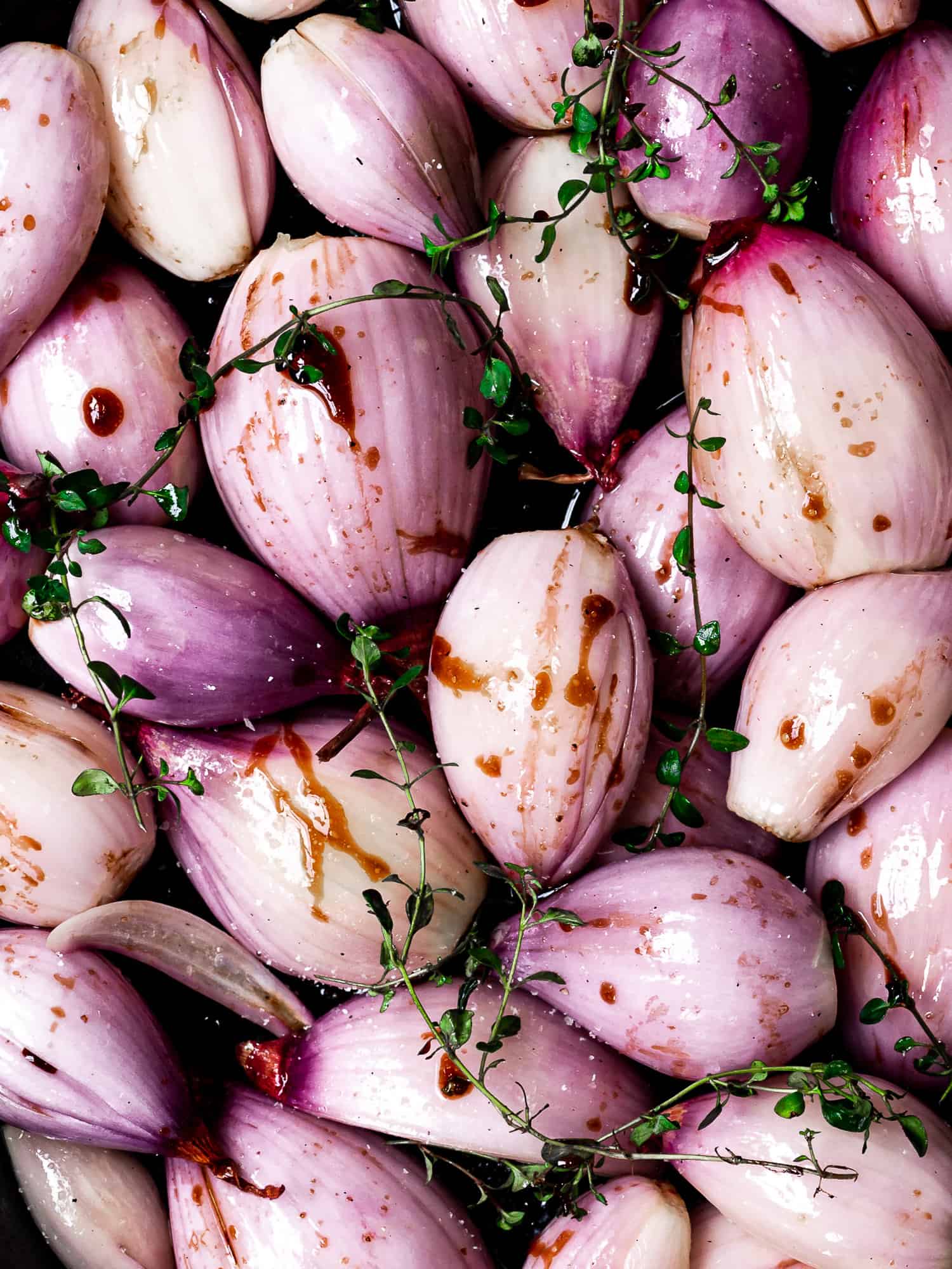 peeled shallots tossed in balsamic glaze