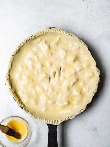 brushing egg wash on puff pastry