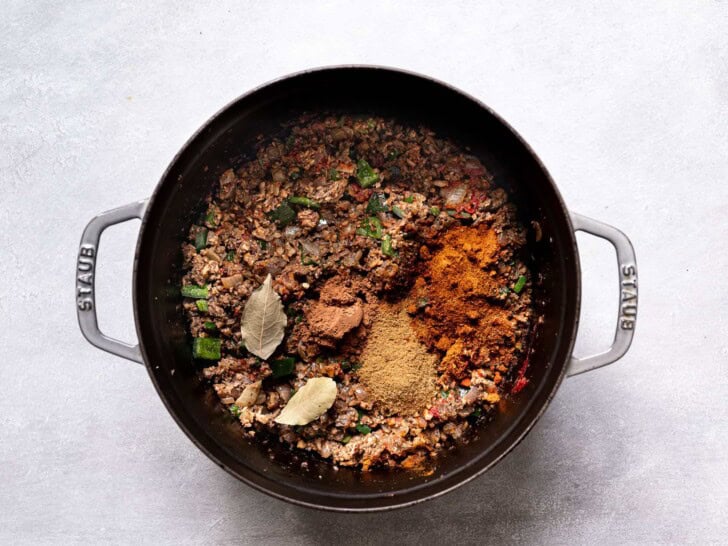 spices with mushroom-walnut mixture in pot