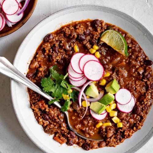 Vegan Chili in a bowl with toppings