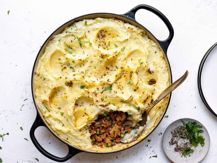 serving Indian-spiced shepherd's pie with plates on the side