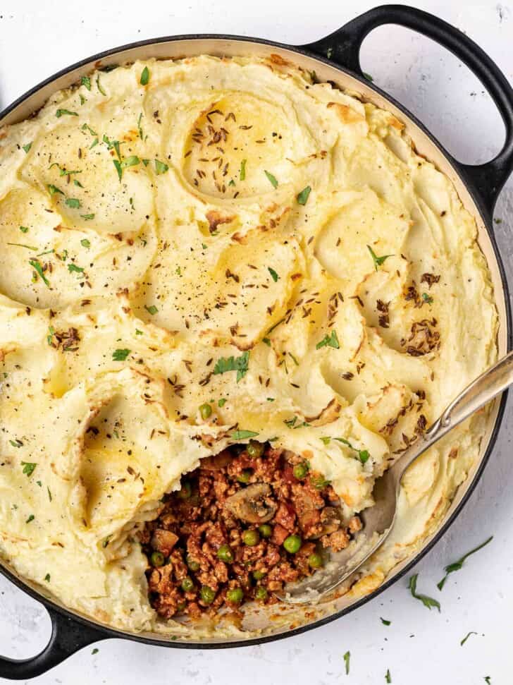 close up of Baked Indian-spiced shepherd's pie in skillet