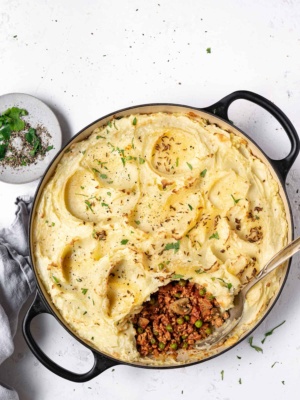 Indian-spiced shepherd's pie being served from skillet