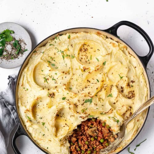 Indian-spiced shepherd's pie being served from skillet