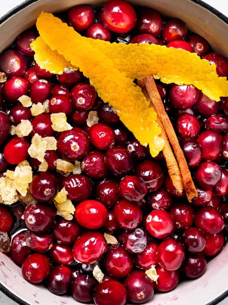 close-up of un-cooked cranberries in saucepan