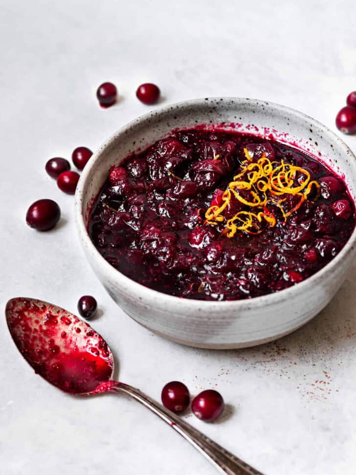 side view of red wine cranberry sauce in bowl