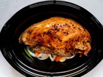 turkey in crockpot on top of vegetables