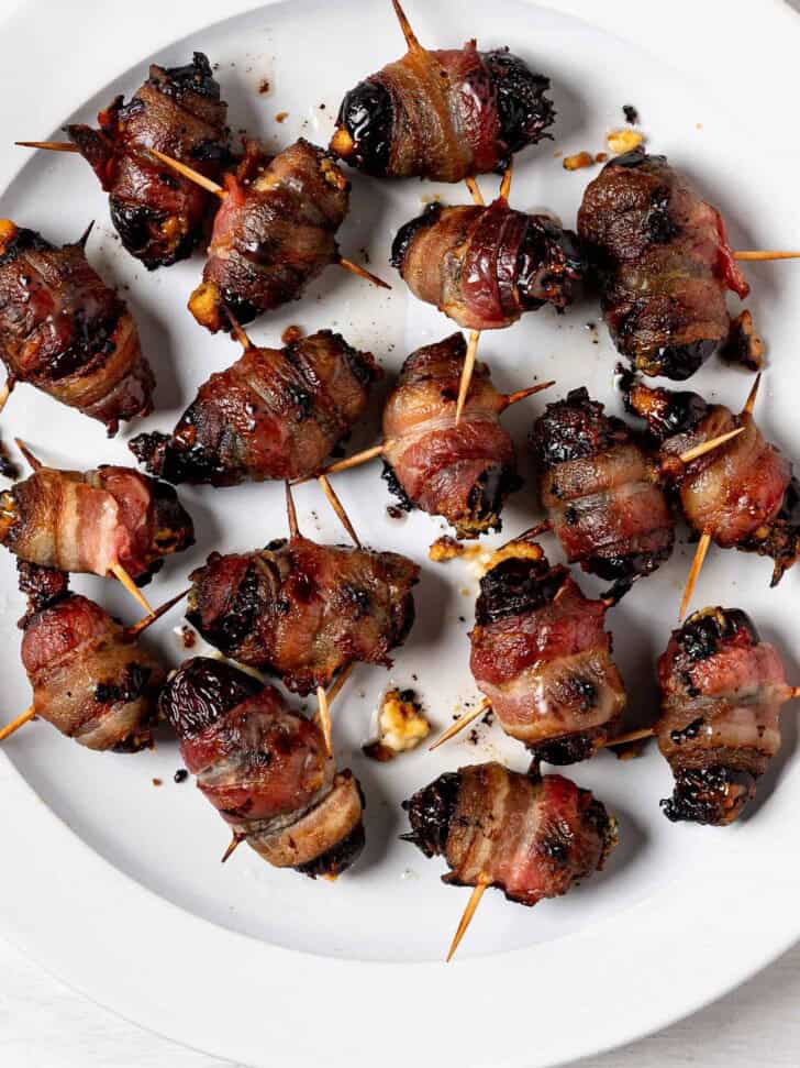 Baked Bacon wrapped dates on plate 