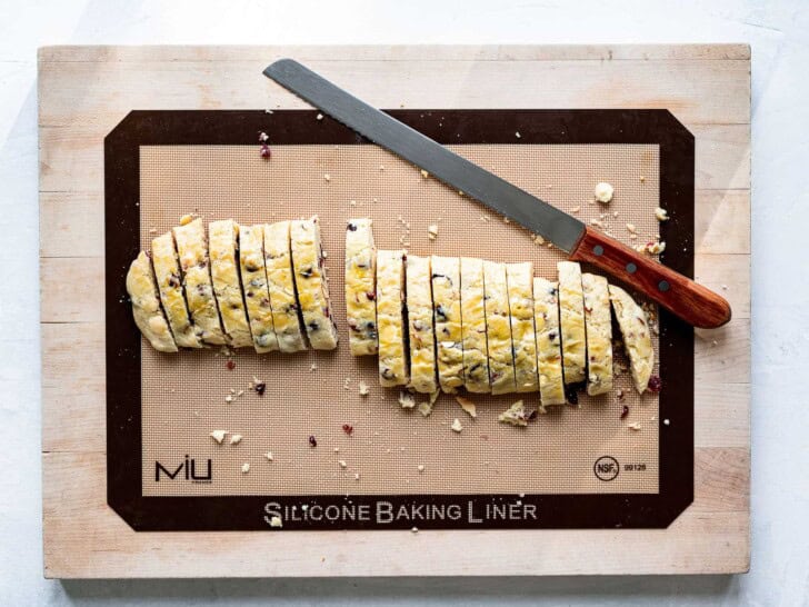 slicing biscotti on cutting board