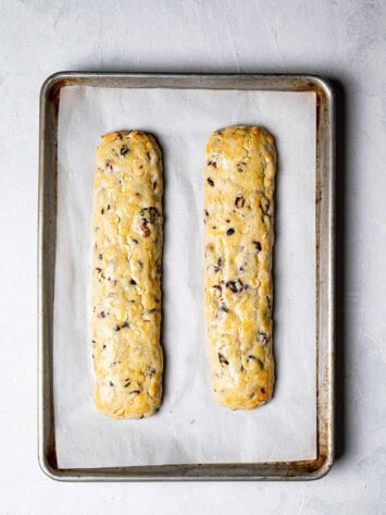 baked biscotti logs on baking sheet