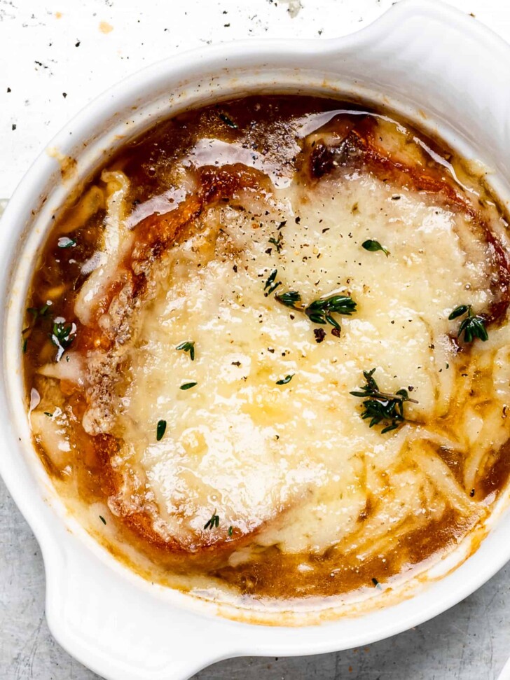 close up of French onion soup bowl with cheesy topping
