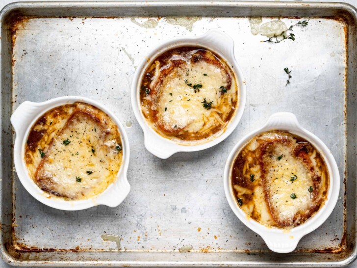 broiled French onion soup bowls with melted cheese 