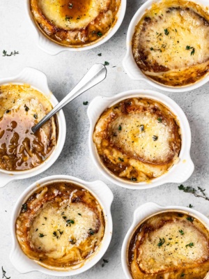 bowls of French onion soup with cheesy topping