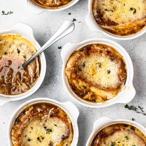 bowls of French onion soup with cheesy topping