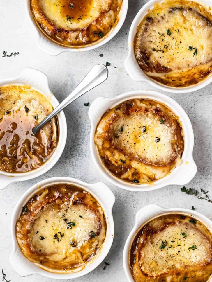 bowls of French onion soup with cheesy topping 