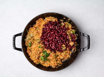 adding beans to skillet