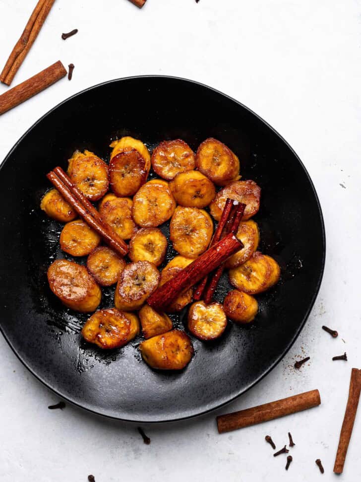 Plátanos al Caldero (sweet caramelized plantains) served on plate