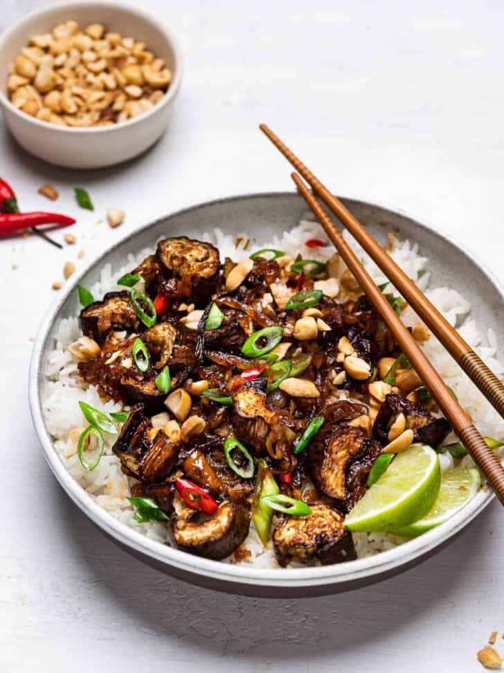 Side-view of Chinese eggplant stir-fry served over coconut rice