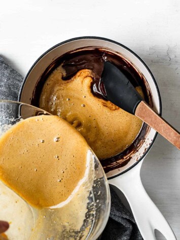 pouring egg mixture into chocolate mixture