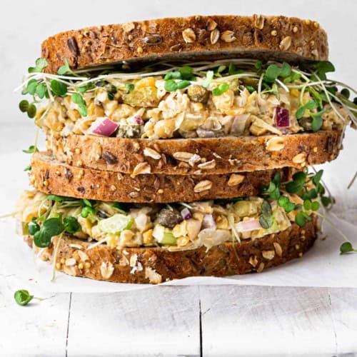 side view of two stacked chickpea salad sandwich