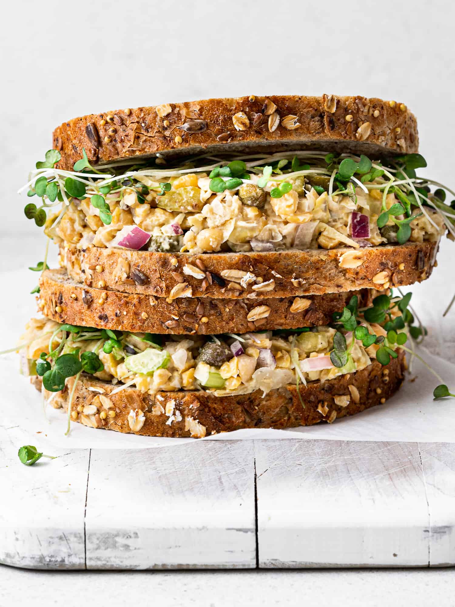 side view of two stacked chickpea salad sandwich