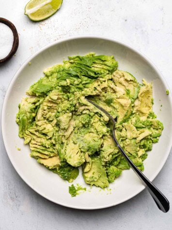 mashing avocados in a bowl