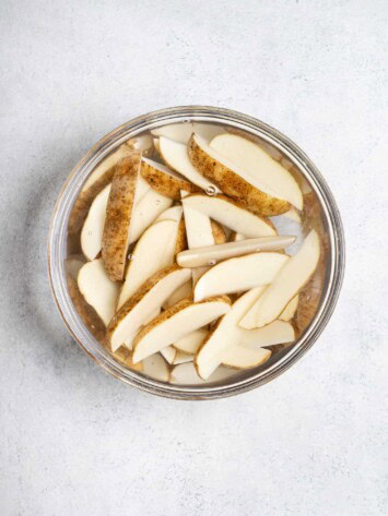 potato wedges soaking in water