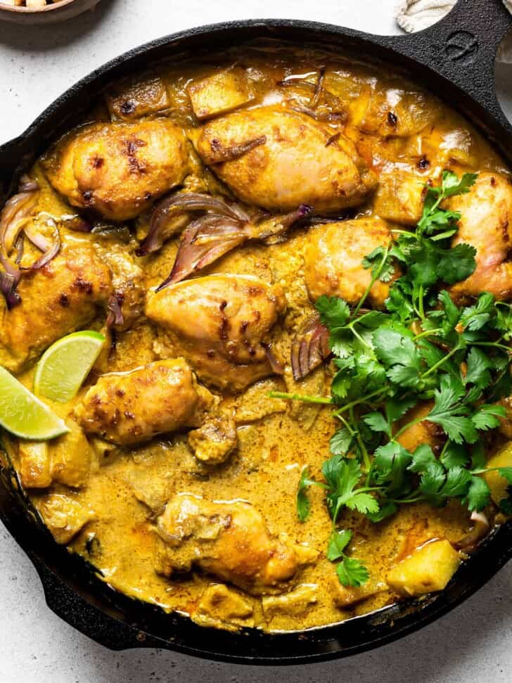 close up of Thai yellow chicken curry in skillet 