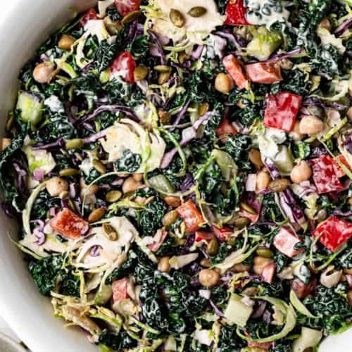 Close up of Chopped Kale Salad with tahini dressing in bowl